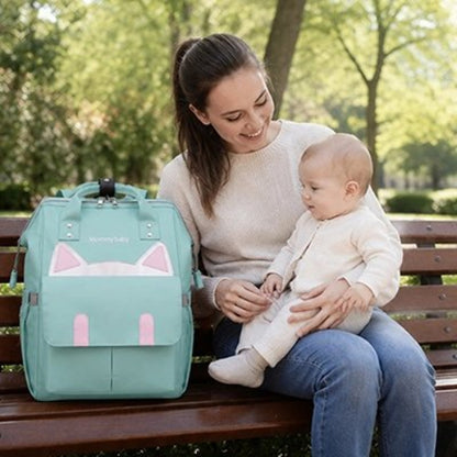 Sac a langer maman porte bebe sur pied assise au parc