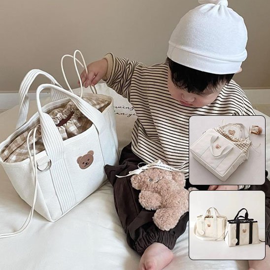 Sac à langer-ours-blanc-bébé-assis-à-côté 